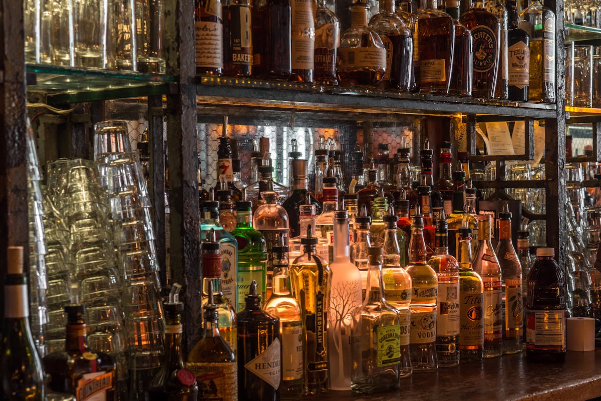 a store shelf filled with wine glasses